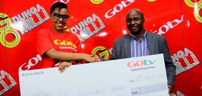 GOtv Kenya General Manager Felix Kyengo hands over the Sh1million dummy cheque for the ongoing promotion