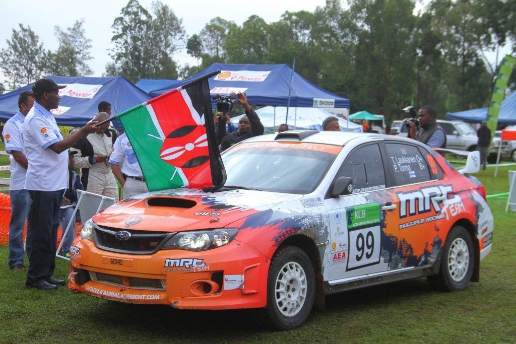 Meru County Governor, Peter Munya flags off Tapio Laukkanen navigated by Pasi Torma in a Subaru Impreza class RC2-R4 at the Meru Technical Training Institute on the 3rd and final day of the 63rd KCB Safari Rally in Meru.